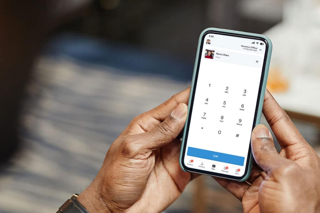 Holding smartphone with Tresta app calls screen